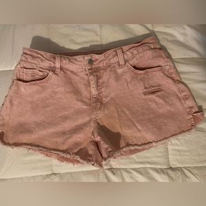 Pink distressed denim shorts